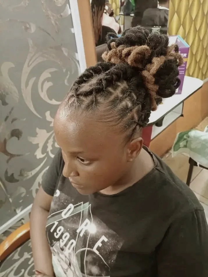 Loc retwist for a young client at the D&Daughters salon in Cheetham Hill