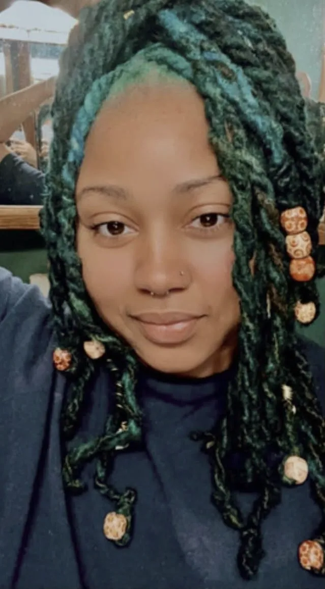 Teal locs with wooden beads