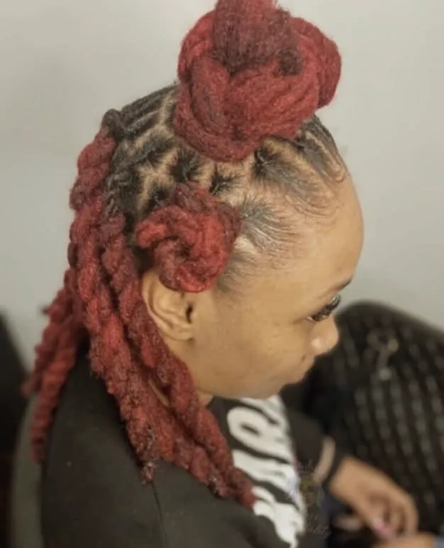 Red loc updo with barrel rolls
